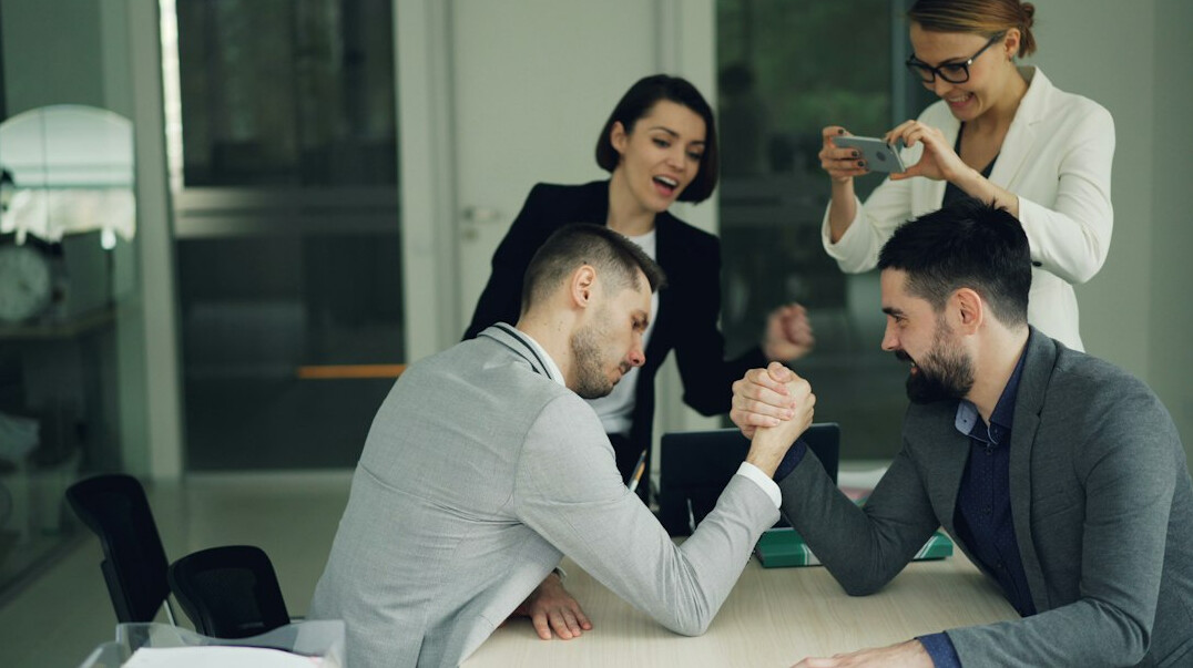 business handshake in office