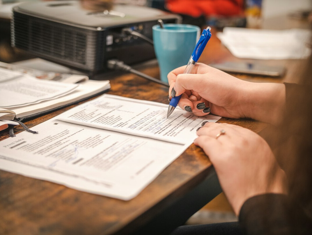 person proofreading document
