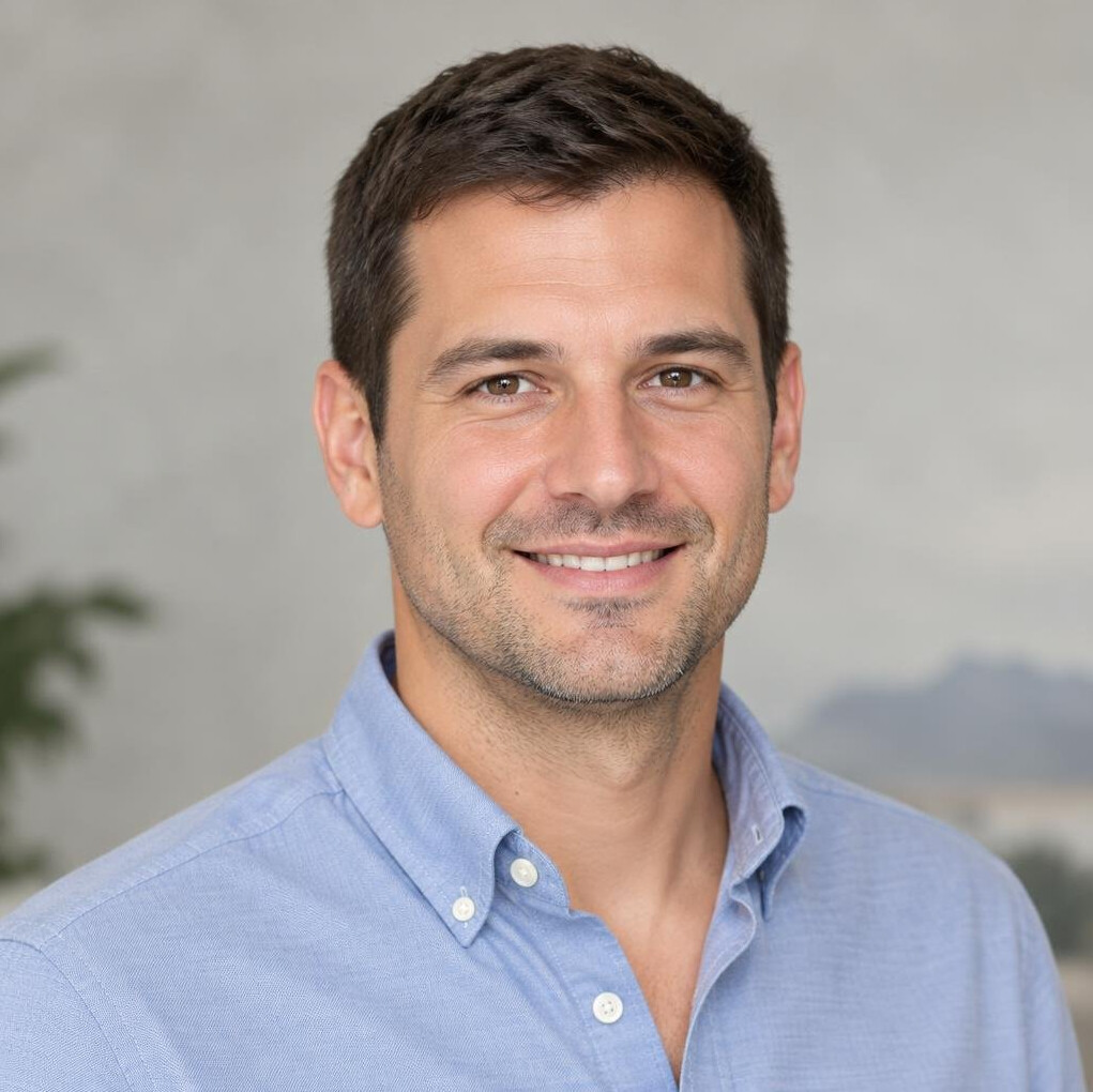 Portrait of a smiling man with short dark hair